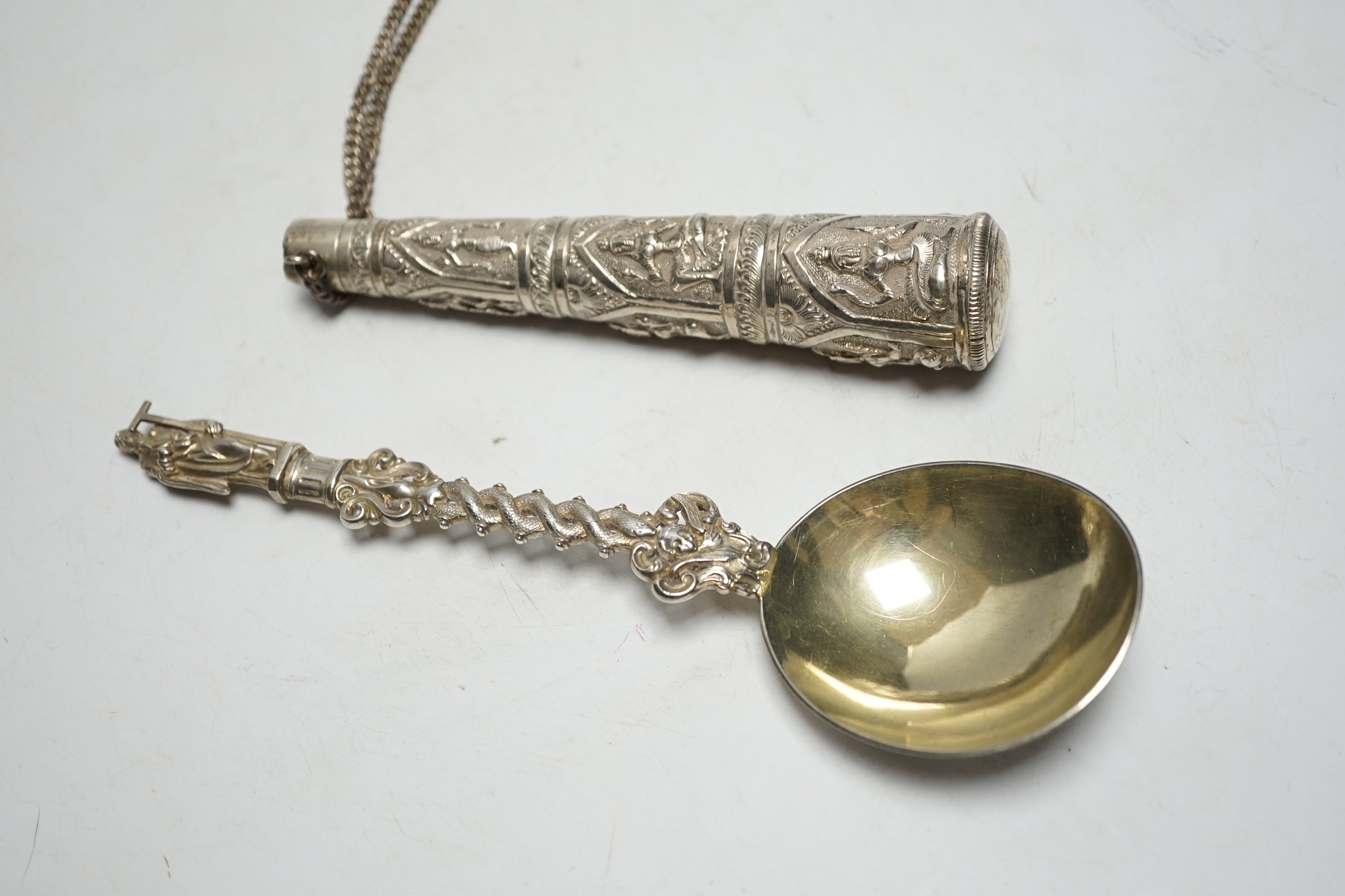 A Victorian silver apostle spoon, Francis Higgins, London, 1884, 20.2cm and an Indian white metal cane handle.